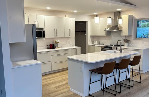 Juneau House | Spacious beachfront retreat with views of Gastineau Channel and downtown Juneau.