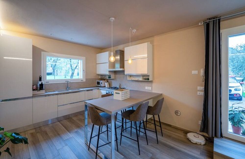 Salo Apartment | New apartment with garden and parking in Salò