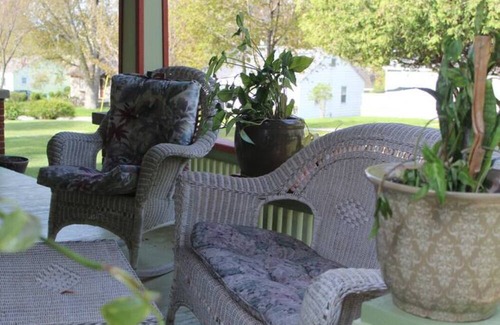 Onekama Apartment | Relax on deck next to the pool in this two room suite.