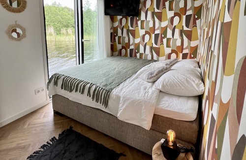 Oud Ade Boat Rental | Houseboat: "De Walvis" at Kagerplassen with tender. 4+ 2 kids