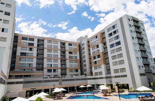 Pousada do Rio Quente Apartment | Resort Park Veredas with the warm river in the background