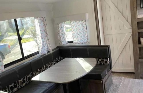 Aurora RV Rental | Camper located in campground! Walking distance to fishing!