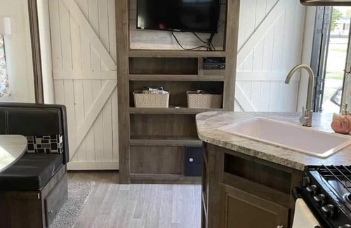 Aurora RV Rental | Camper located in campground! Walking distance to fishing!