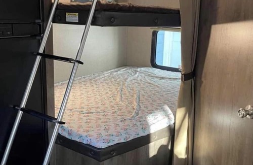 Aurora RV Rental | Camper located in campground! Walking distance to fishing!