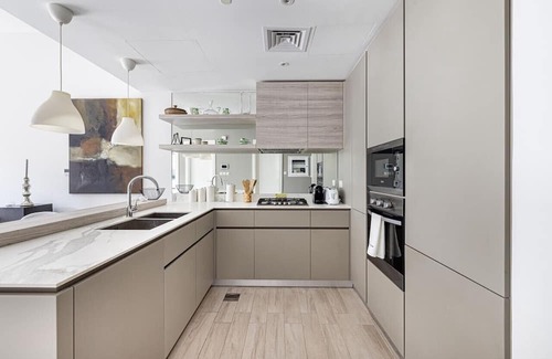 Madinat Zayed Apartment | Stylish 1BR Apartment with Community View