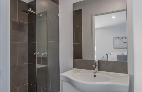 Pottsville Apartment | Escape to your own tropical oasis with this stunning retreat-style home boasting 4 large bedrooms, all with fans and robes, and 3 bathrooms.