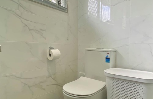 Centenary Heights Apartment | Modern Studio Room Retreat with a reverse Aircon
