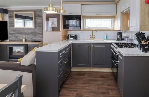 Hopton Cottage | STAG LODGE, CARAVAN 70, with pool in Belton, Norfolk