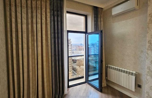 Nasimi Apartment | Charming Apartment with Side Sea View, Steps from the Metro