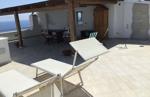 Ischia Porto Apartment | Attic room with terrace and lots of views