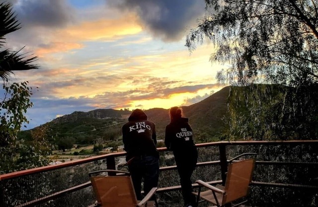 Beautiful luxurious house looking at canyon and mountains, gorgeous sunset.